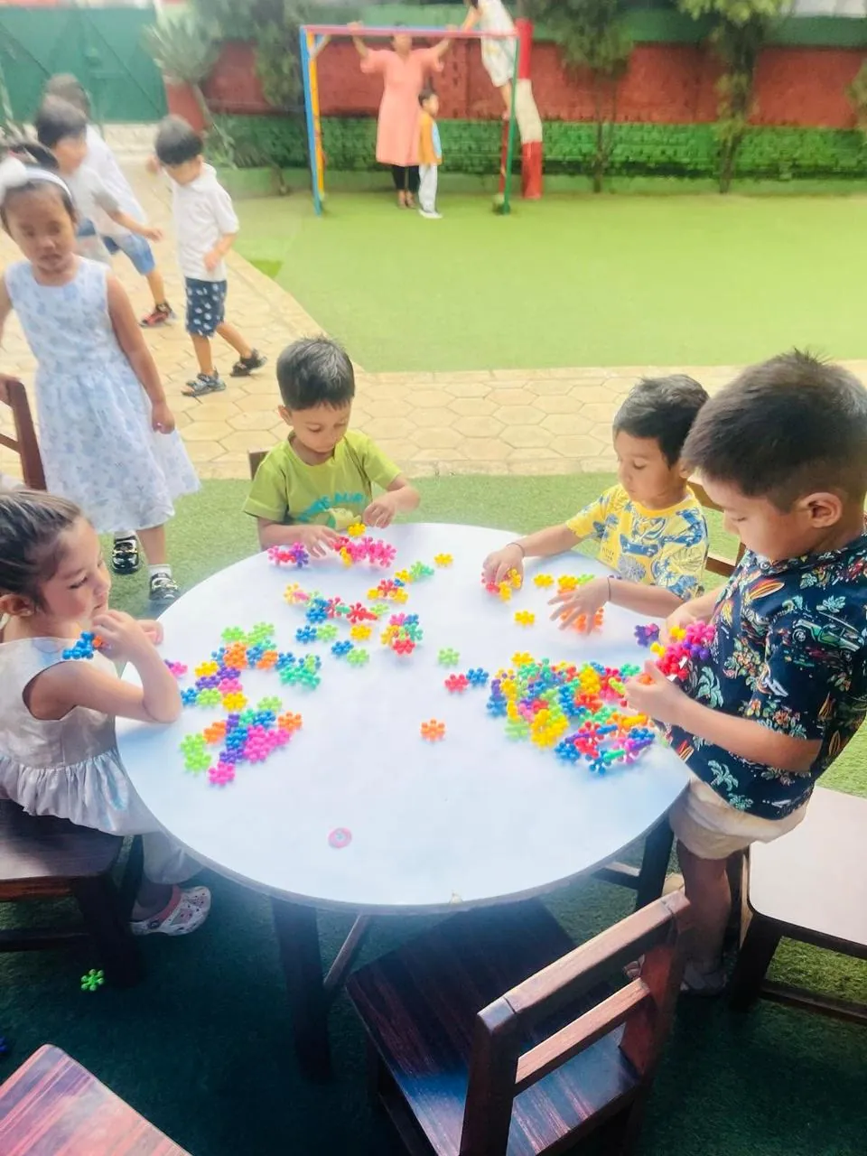 Children showcasing their creativity by building toys from tiny blocks.