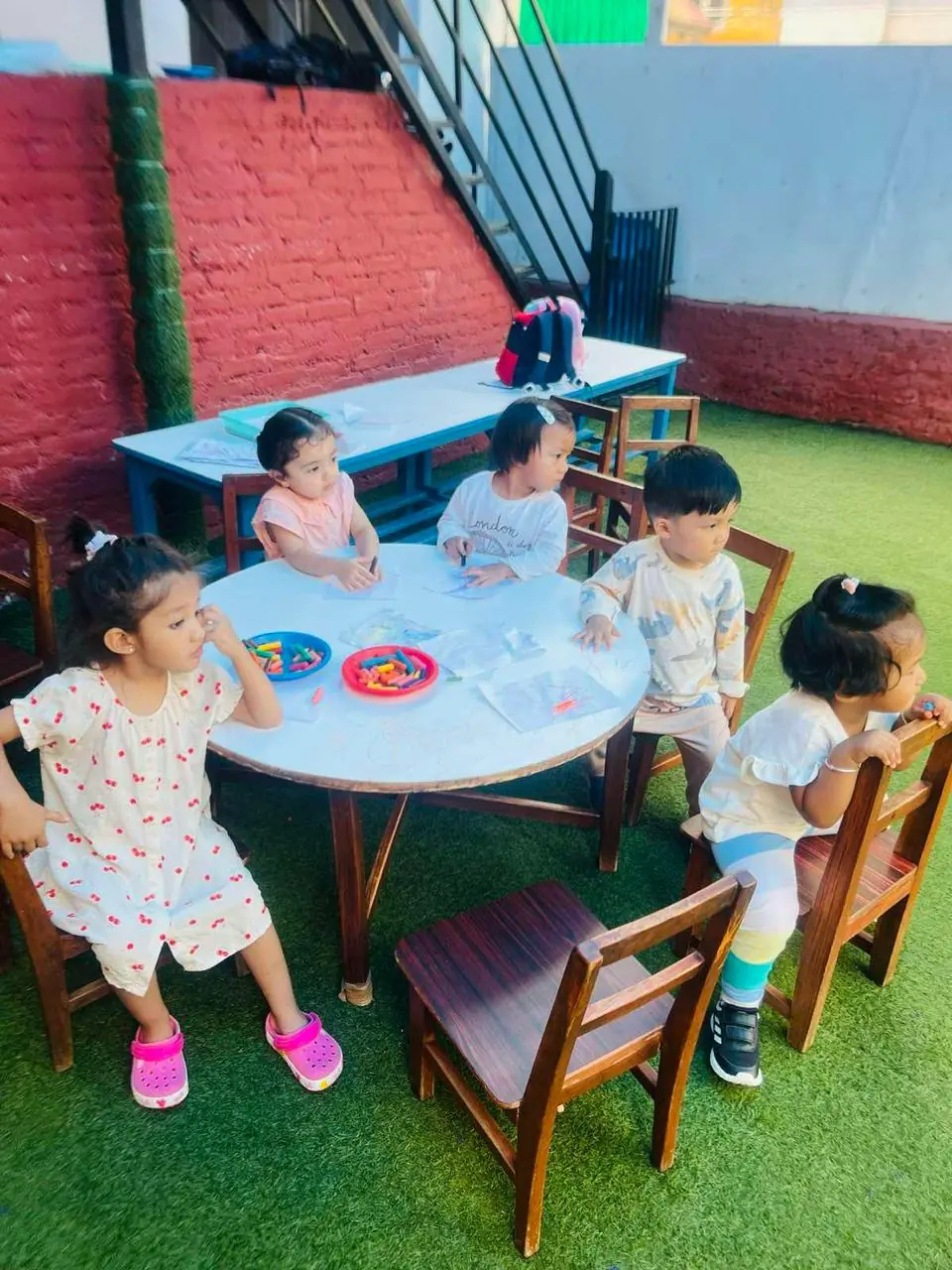 Children curiously observing the surrounding environment.