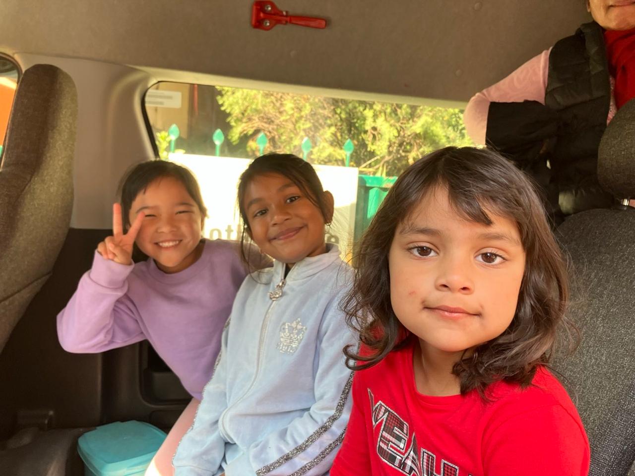 Children on their way to a fun trip organized by Mother Care.