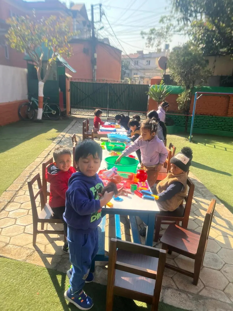 Children playing with toys as part of a fun learning experience.