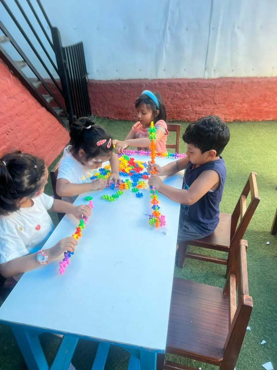 Children showcasing their creativity by building toys from blocks.
