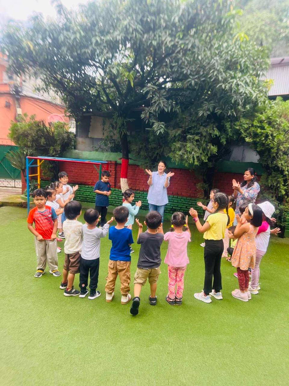 Children playing outdoor on Mother Care's premises.